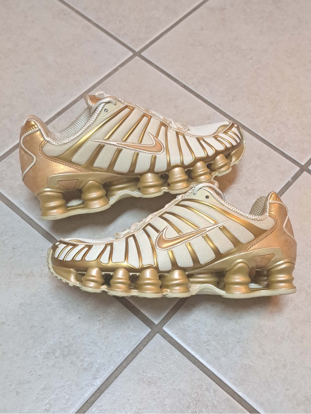Nike Shox TL in a Coconut Milk/Metallic Gold colorway - Women's size 8.5